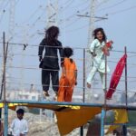 Children enjoy jumping on the trampoline at Qasimabad