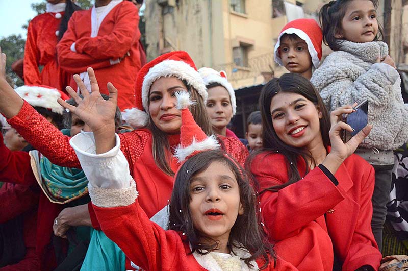 The female participants of a ‘Christmas Aman Rally’ waving their hands