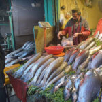 Vendor selling and displaying fish during cold weather to attract the customers at Ghanta Ghar Chowk