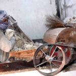 Labourer busy ginning of cotton at his workplace