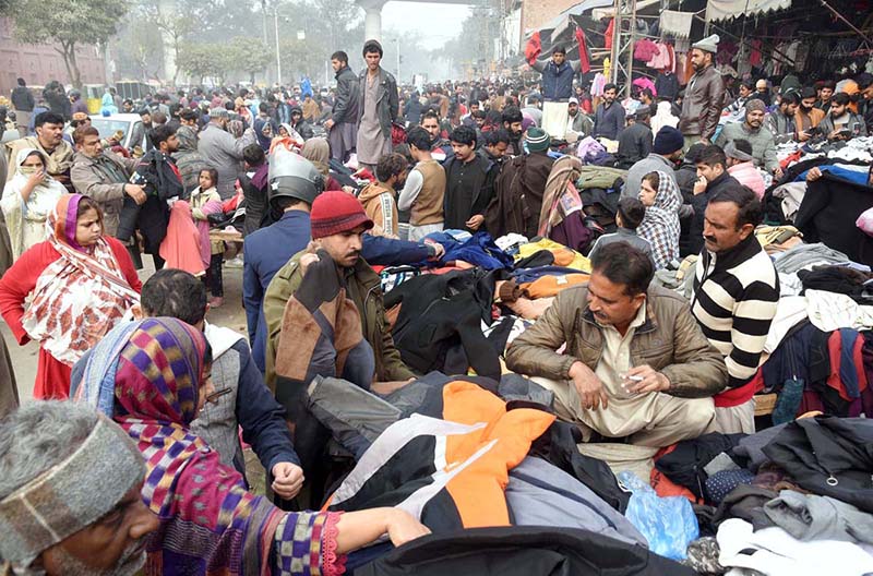 People selecting and purchasing used warm clothes at Empress Road as demand increase during winter season in the Provincial Capital