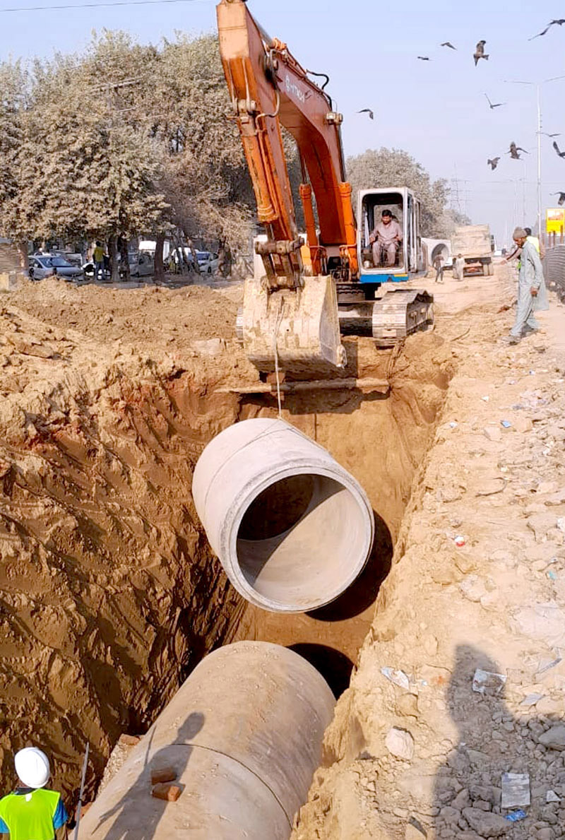 Heavy machinery being used to expand roads during development work in the city