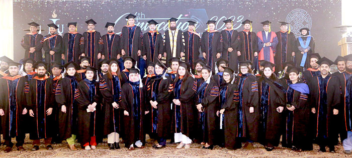 Caretaker Federal Minister for Information & Broadcasting, Murtaza Solangi and Punjab Governor Balighur Rahman in a group photo with graduates at the 4th Convocation of Information Technology University, Main Campus.