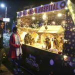 Christian couple viewing the imagery hovering at St. Elizabeth hospital in preparation of Christmas celebrations