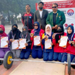 Group photo of Former Captain and International Weightlifter Aqeel Javed Butt with the National Team at the Punjab Police Inter-Range Athletics Championship