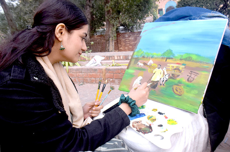 Student giving final touch to the paintings at Punjab Institute of Art and Culture