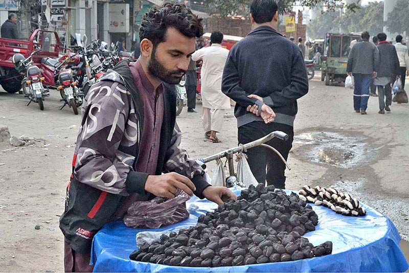 A vendor displaying Sangara to attract the customers on his bi-cycle in a local market