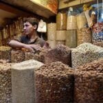 Vendor displaying dry fruits to attract the customers at bacha khan chowk