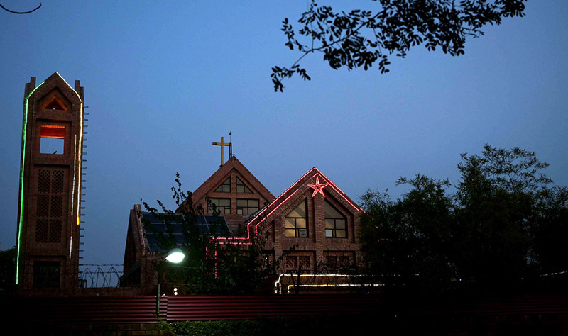 An eye-catching view of a Church at G-7 decorated with colorful lights during Christmas celebrations