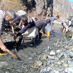 Water and Power staffer busy in diverting water to the power house for the smooth supply of power in city