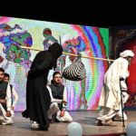 Students performing on stage during seminar on International Day of Persons with Disabilities at Punjab Council of Arts.