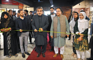 Caretaker Federal Minister for National Heritage and Culture, Jamal Shah cutting ribbon to inaugurate Exhibition of Books and Photographs in connection with upcoming Quaid-i-Azam Day at Heritage Museum, Lok Virsa