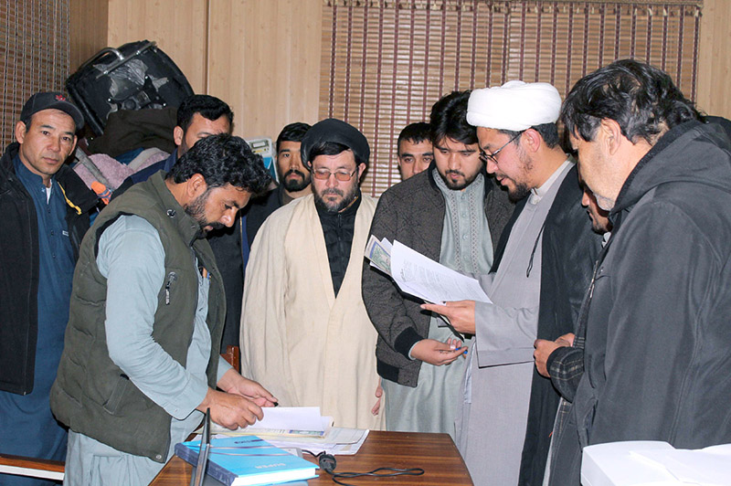 Returning Officer reviewing the nomination papers of candidates contesting in election for NA-264