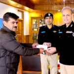 Inspector General of Police Gilgit-Baltistan Afzal Mehmood Butt giving away certificate and cash prize to CTD Police Personal for best performance at CPO