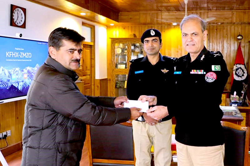 Inspector General of Police Gilgit-Baltistan Afzal Mehmood Butt giving away certificate and cash prize to CTD Police Personal for best performance at CPO