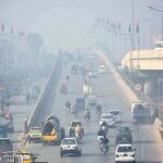 Vehicles on the way as thick fog that engulfs the whole city during morning time