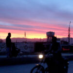 A beautiful view of colorful clouds hovering over the city