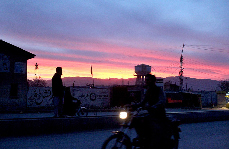 A beautiful view of colorful clouds hovering over the city