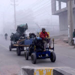 A view of commuters traveling through fog