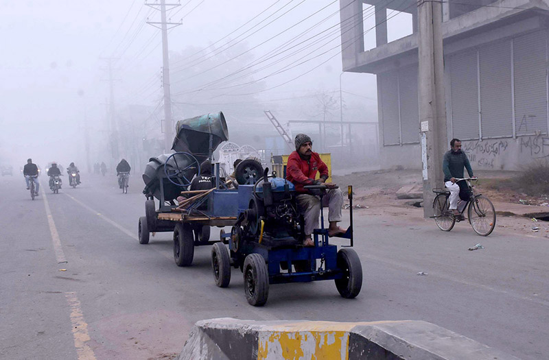 A view of commuters traveling through fog