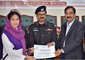 DIG Prison Chaudhary Saeed Ullah and Former President SCCI Mukhtar Mirz giving appreciation certificates to best volunteers of Sargodha Division during a seminar on eve International Volunteer’s Day organized by NCHD held at University of Sargodha