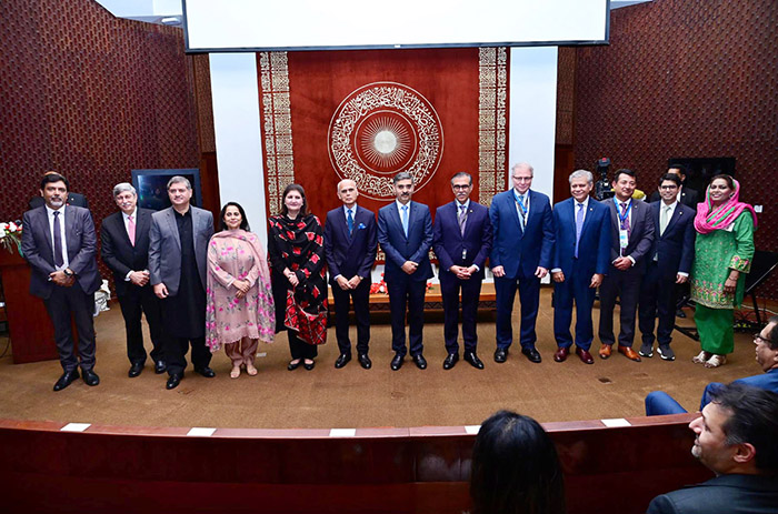 Caretaker Prime Minister Anwaar-ul-Haq Kakar in a group photo with the faculty of Aga Khan University and esteemed guests of Health Tech Summit
