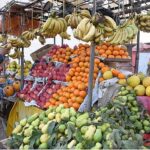 A vendor displaying fruits to attract the customers at Sachal Colony Road