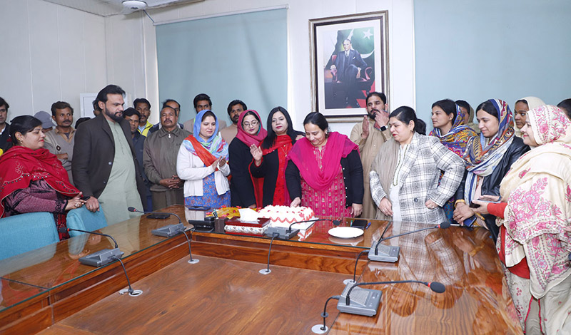 Prof Dr Zill-i-Huma Nazli Vice Chancellor (VC) Government College Women University Faisalabad (GCWUF) cutting the Christmas cake along with Christian employees at GCWUF