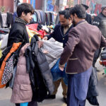 A vendors selling and displaying jackets at McLeod Road