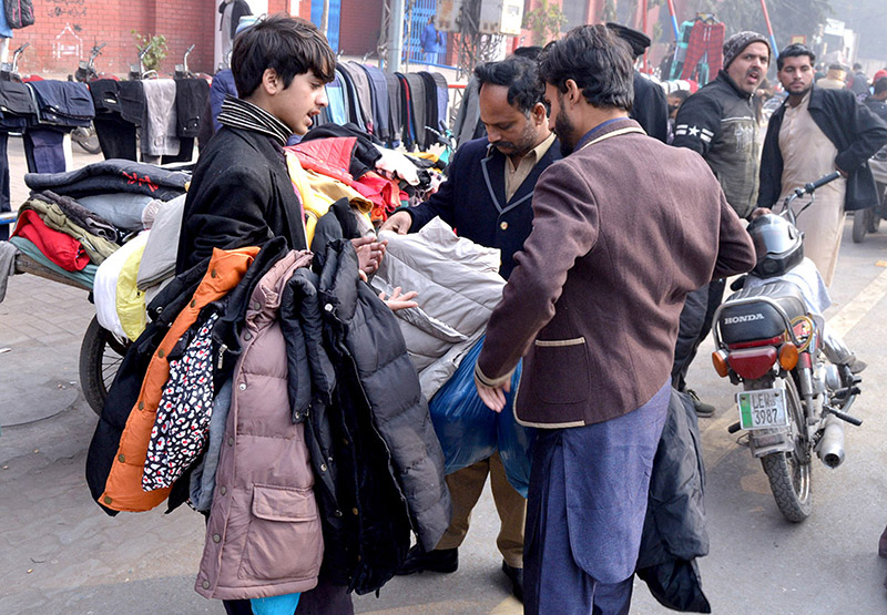A vendors selling and displaying jackets at McLeod Road