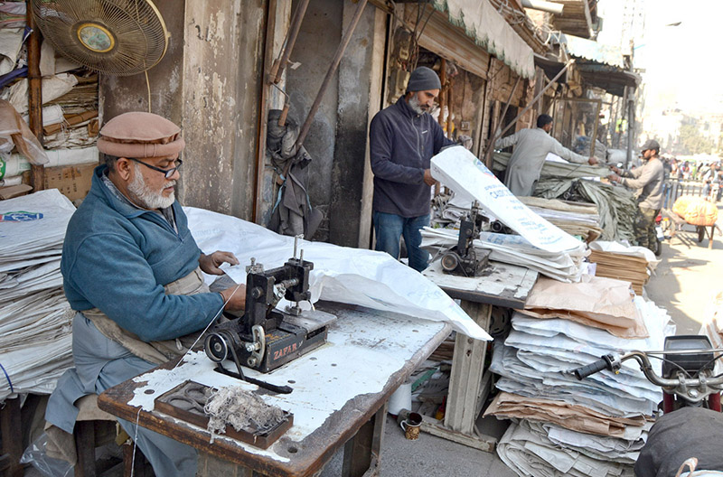 Workers sewing bags at their workplace