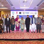 VC SBBWU Prof. Dr. Safia Ahmed, SRSP CEO Masaud ul Mulk and UNHCR KP Head Kofi Ohenenana Dwomo giving shield to Governor KP Haji Ghulam Ali during 1st International Women Conference on Breaking Barriers, Building Bridges, Uniting Women's Voice for a Better World at Local hotel