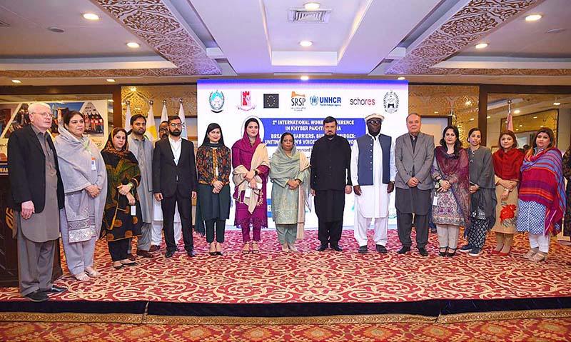 Group photo of VC SBBWU Prof. Dr. Safia Ahmed, SRSP CEO Masaud ul Mulk and UNHCR KP Head Kofi Ohenenana Dwomo along with Governor KP Haji Ghulam Ali during 1st International Women Conference on Breaking Barriers, Building Bridges, Uniting Women's Voice for a Better World at Local hotel