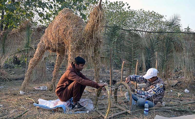 Youngsters from Christian community preparing Christmas Crib in connection of Christmas celebrations at G-7 area