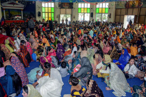 Christian community members performing religious rituals on Christmas Day at Catholic Church Railway Road.