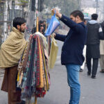 A vendor selling and displaying handkerchief at Shalmi Bazaar