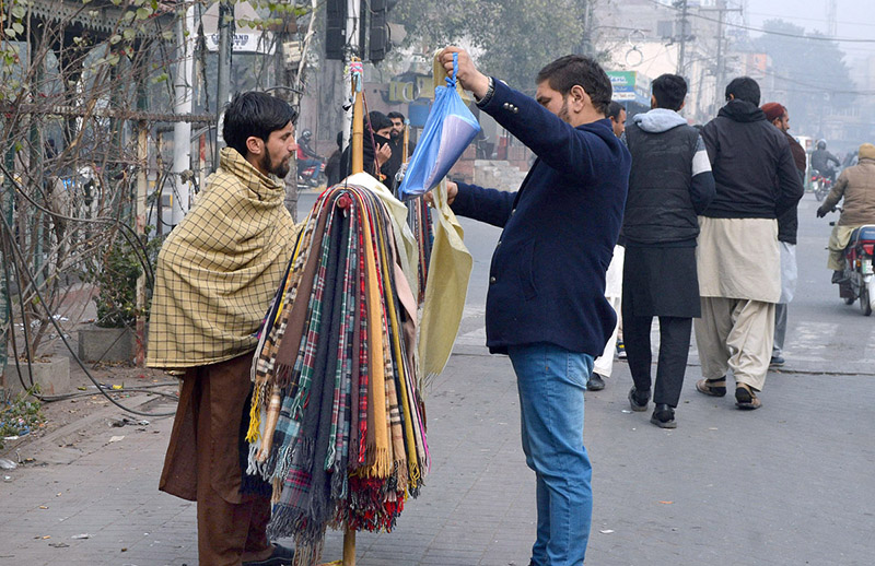 A vendor selling and displaying handkerchief at Shalmi Bazaar