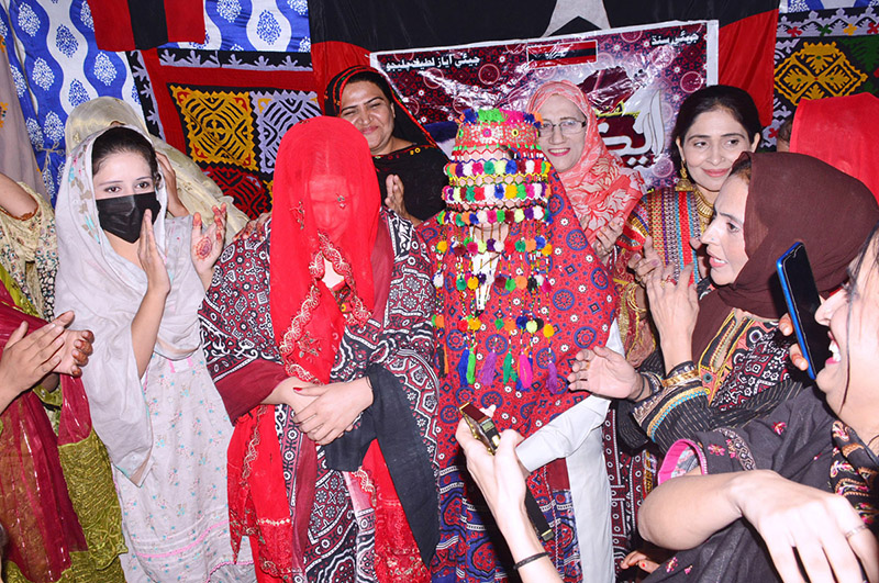 Girls students performing the tableau on stage during the program in connection with Sindhi Culture Day at the NS Montessori School