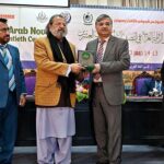 Vice Chancellor AIOU, Prof Dr Nasir Mahmood giving shield to Caretaker Federal Minister for Education and Professional Training, Madad Ali Sindhi during 3rd International Conference on "Modern Trends in the Arab Novel in the Second Half of the Twentieth Century” organize by AIOU at Academic Auditorium