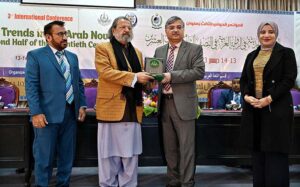 Vice Chancellor AIOU, Prof Dr Nasir Mahmood giving shield to Caretaker Federal Minister for Education and Professional Training, Madad Ali Sindhi during 3rd International Conference on "Modern Trends in the Arab Novel in the Second Half of the Twentieth Century” organize by AIOU at Academic Auditorium