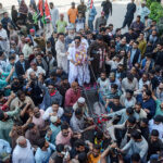 Pakistan People's Party (PPP) General Secretary Karachi Javed Nagori with his supporters riding on donkey cart to submit nomination paper of PS-106 for the upcoming General Election 2024 at Deputy Commissioner South office