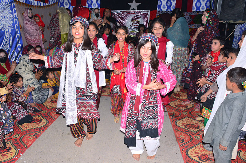 Girls students performing the tableau on stage during the program in connection with Sindhi Culture Day at the NS Montessori School