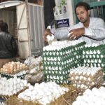 Vendor displaying eggs to attract the customers at his setup in a local market as demand increased due winter season