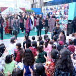 Girls students performing the tableau on stage during the program in connection with Sindhi Culture Day at the NS Montessori School