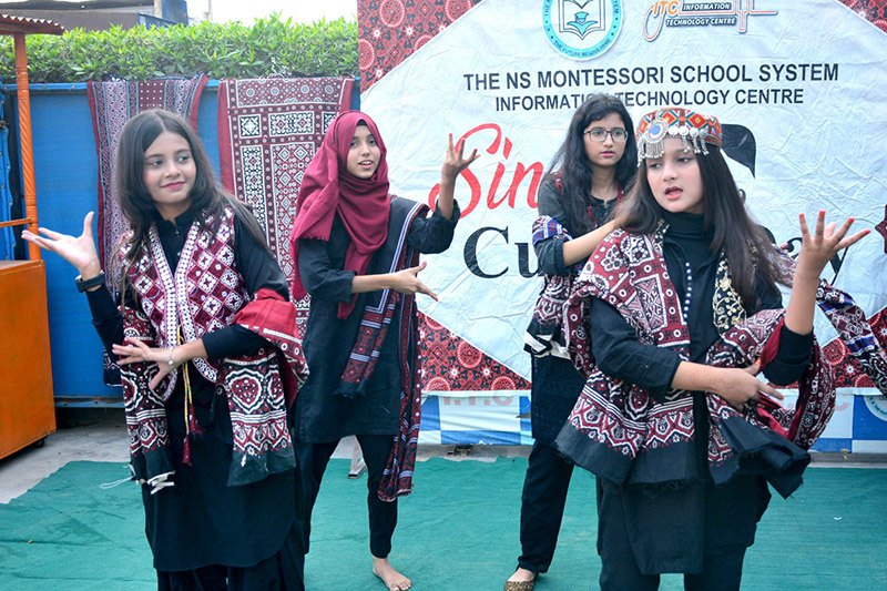 Girls students performing the tableau on stage during the program in connection with Sindhi Culture Day at the NS Montessori School