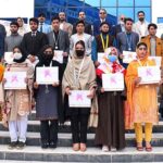 Deputy Chairman Senate of Pakistan Mirza Muhammad Afridi, Managing Director PMDC Muhammad Sabur Sethi and Director Colleges Muhammad Sohail in a group photo with position holder students during Academic Excellence Award Ceremony of Peshawar Model Degree Colleges