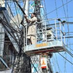 A MCS worker busy in repairing street light