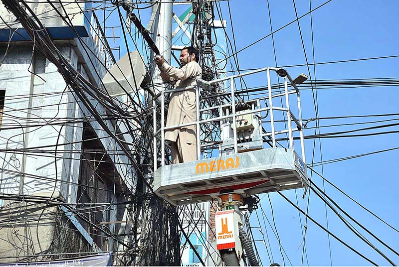 A MCS worker busy in repairing street light
