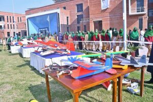 Student viewing an exhibition of plane models at Air University during International Civil Aviation Day was officially designated by the United Nations General Assembly in 1996