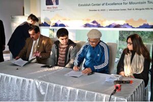 Caretaker Minister of State for Tourism and Chairman of PTDC, Wasi Shah, witnessing MoU signing ceremony between Pakistan Tourism Development Corporation and University of Baltistan, Skardu to Establish Center of Excellence for Mountain Tourism at Skardu at Trail-5 Margalla Hills National Park